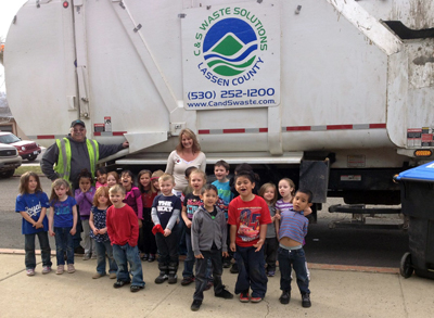 McKinley students in front of the big truck with Michelle Williams and Kevin Anderson from C&S Waste.